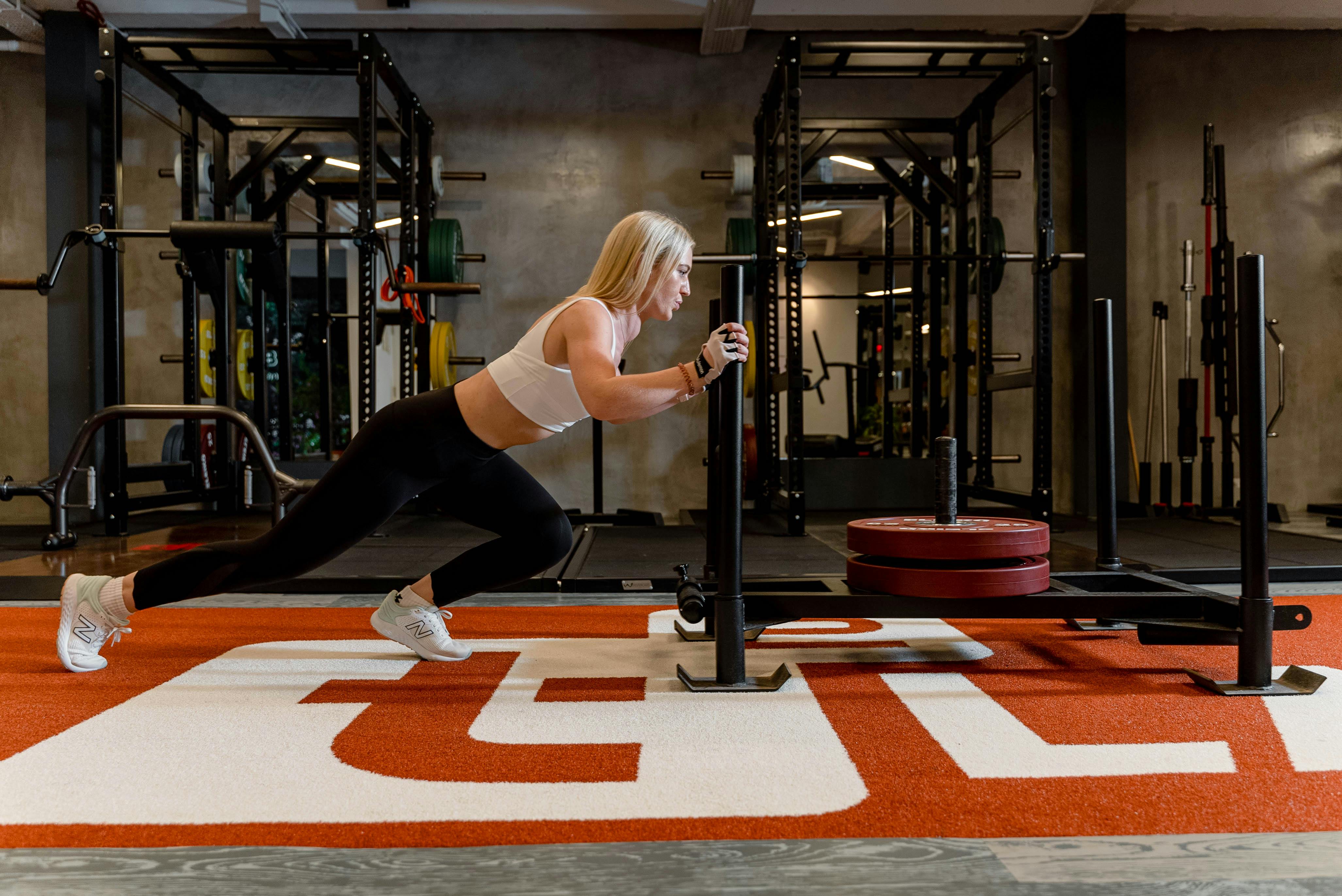 Woman doing strength training in modern gym